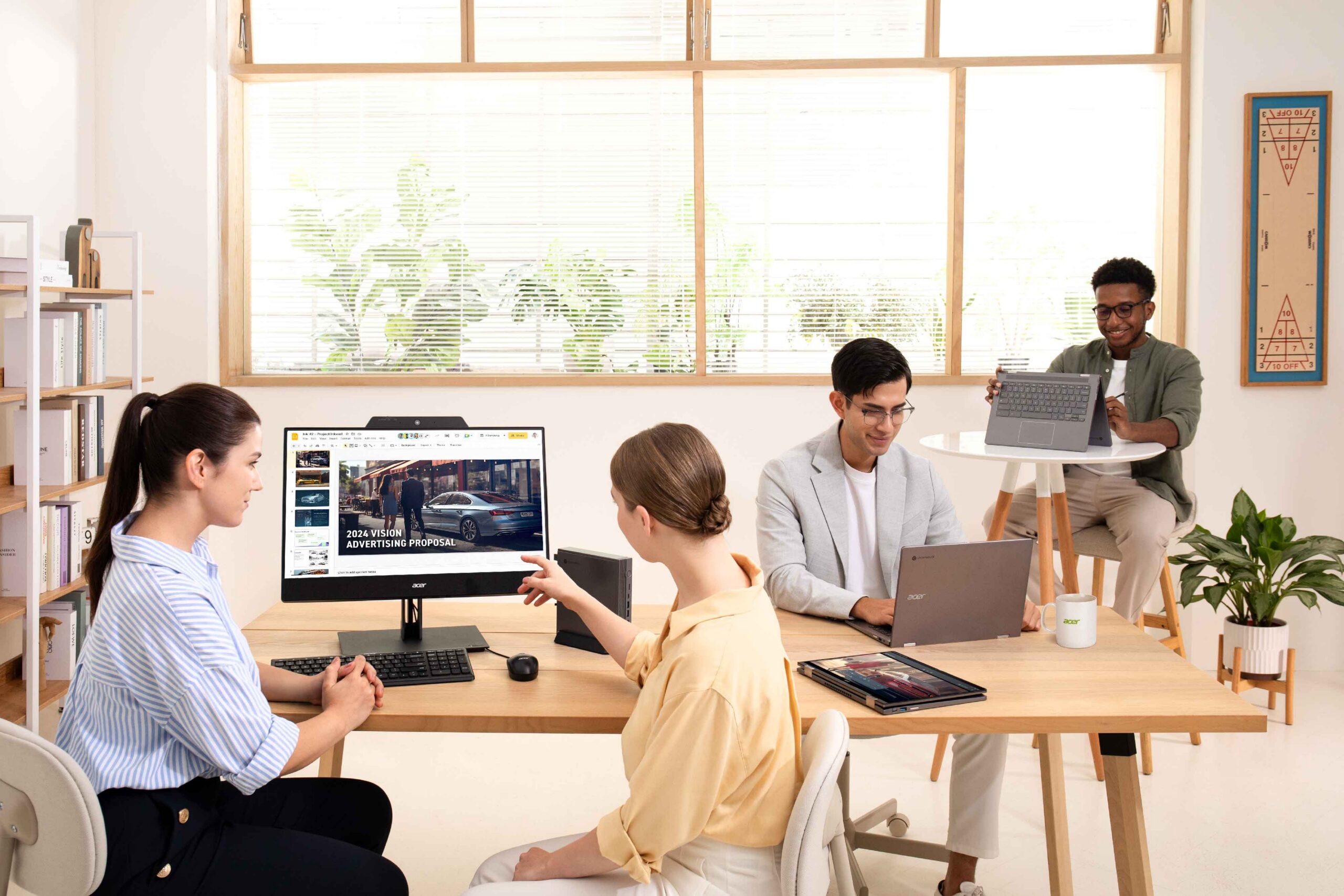 People using Acer laptops, desktops & displays in an office.