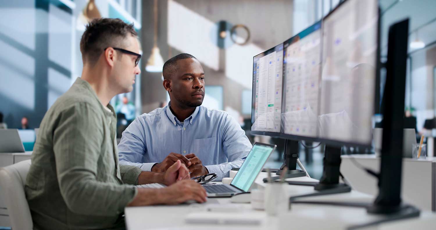 IT colleagues reviewing cyber alert